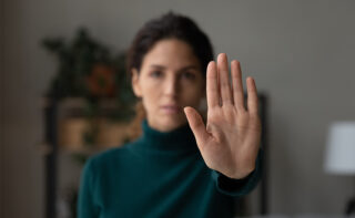 Crop,close,up,of,young,latino,woman,show,no,palm